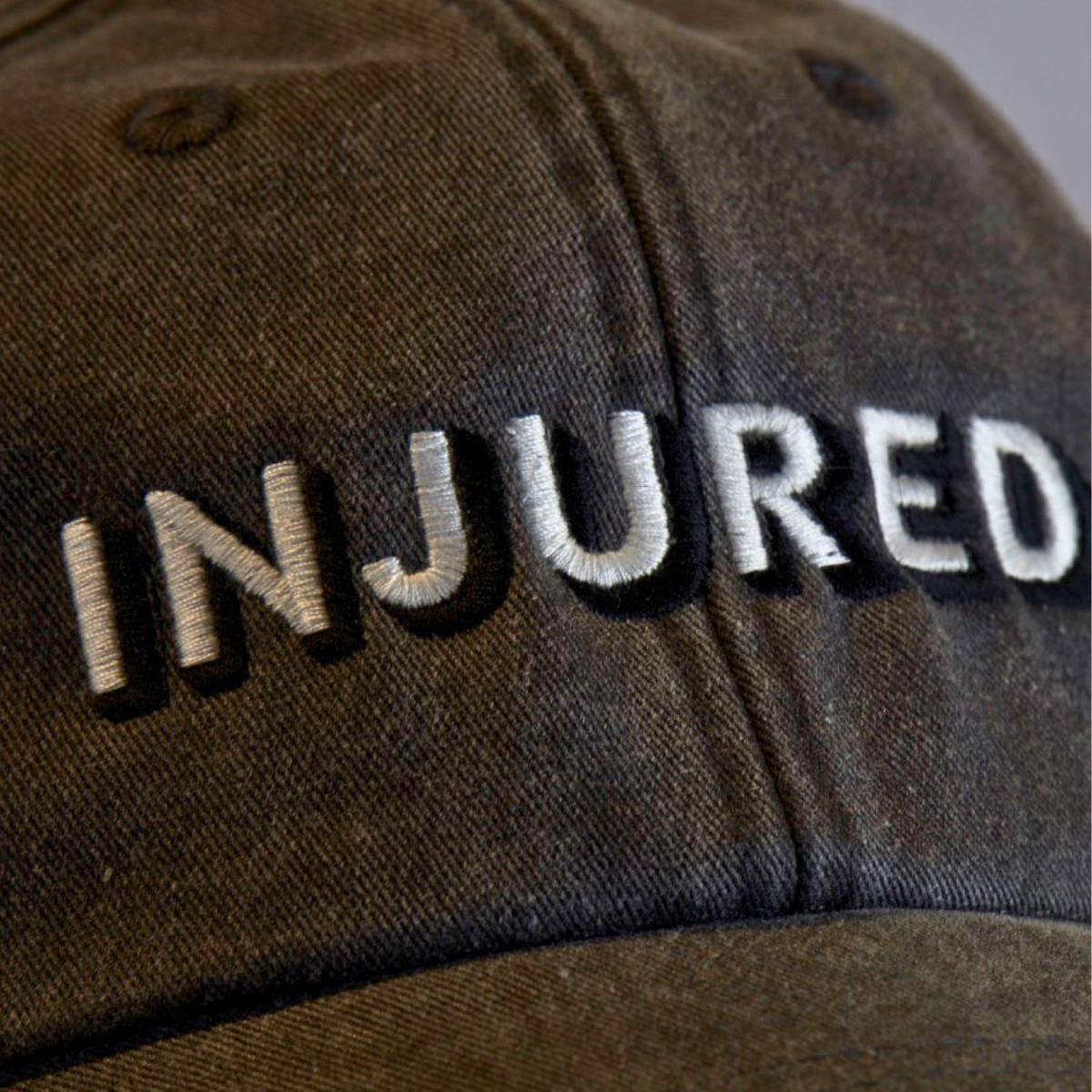 Injured | Embroidered Dad Cap