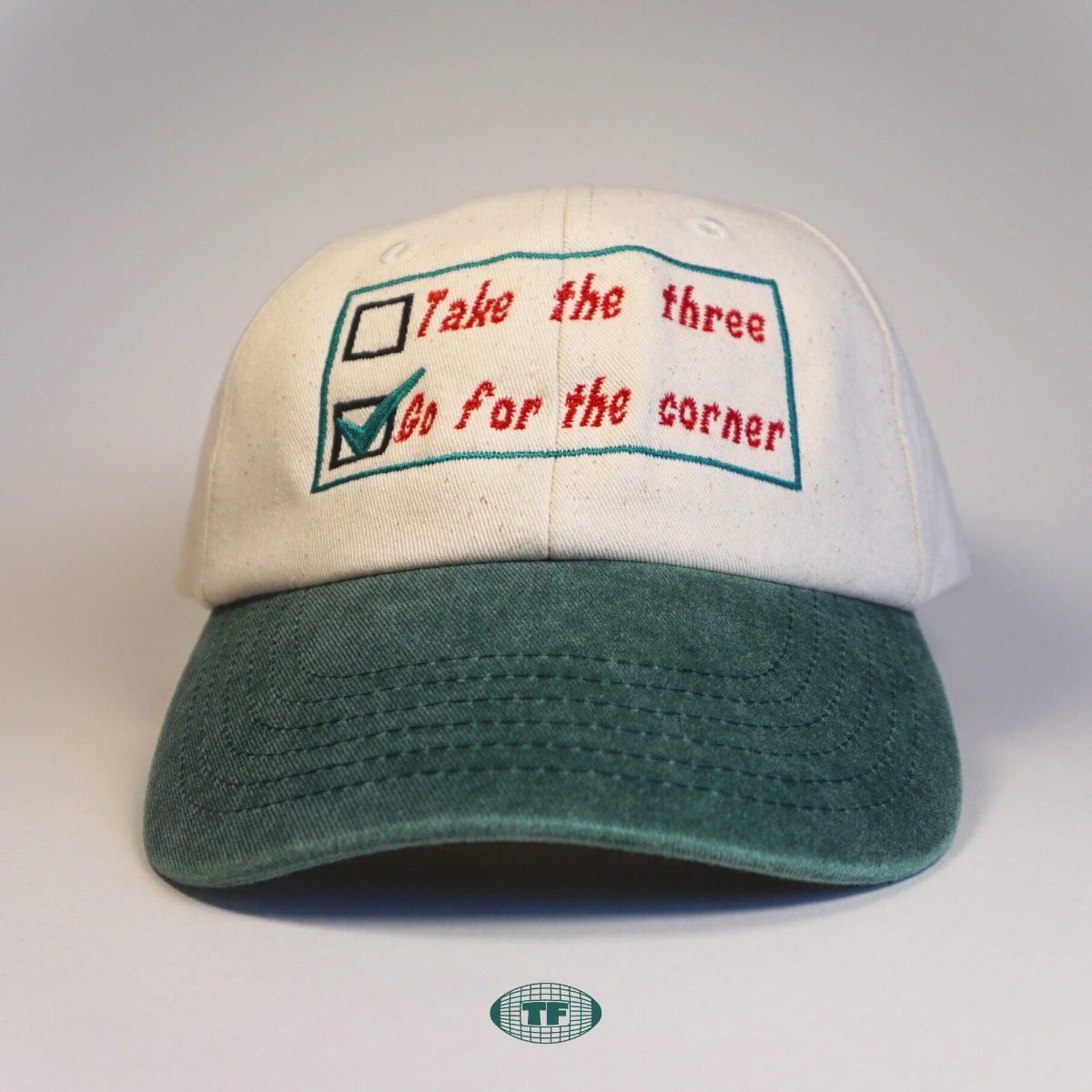 Cream cap with green peak with go for th corner rugby embroidery